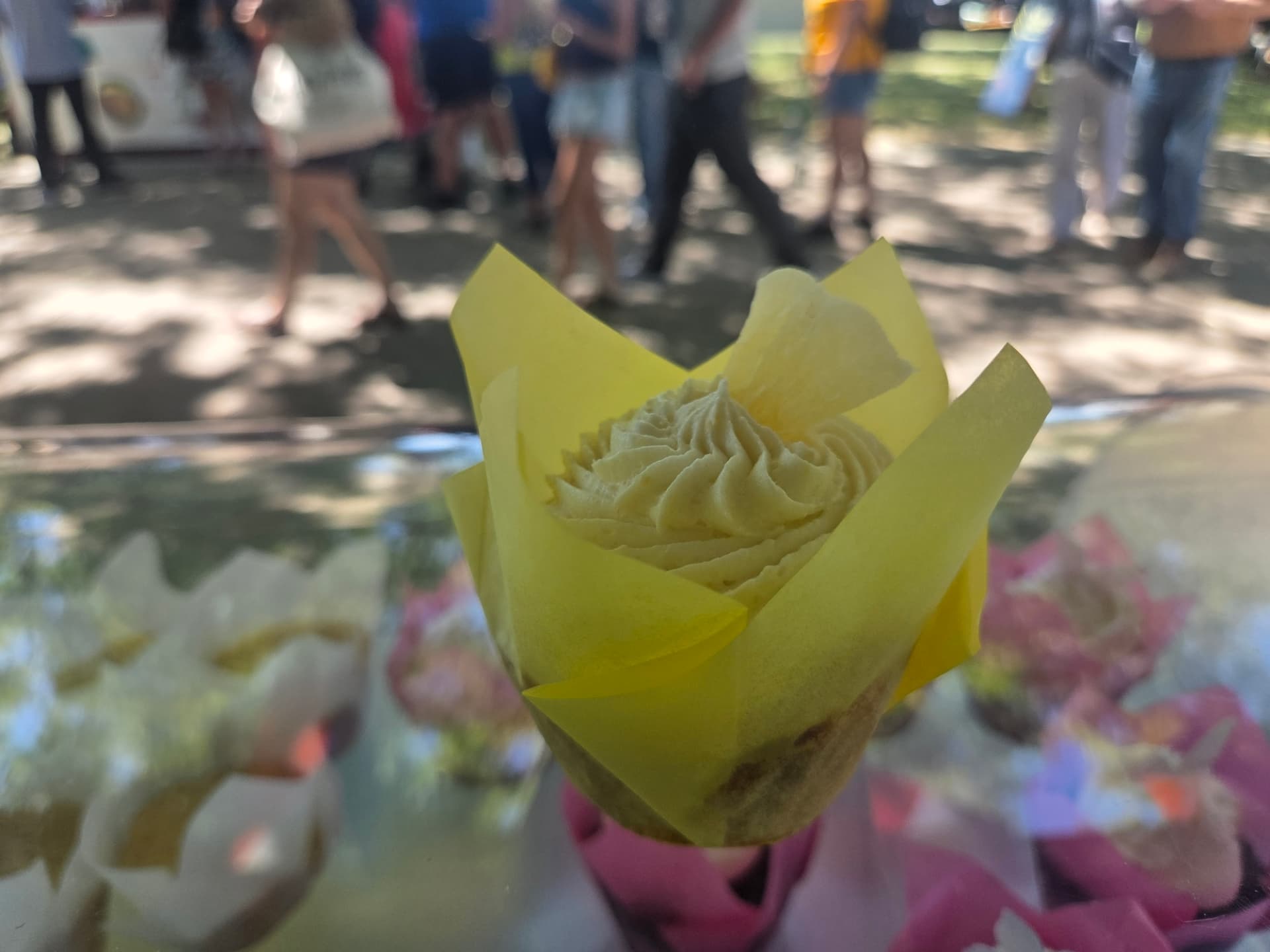 Lemon cupcake with piped frosting at a market stall